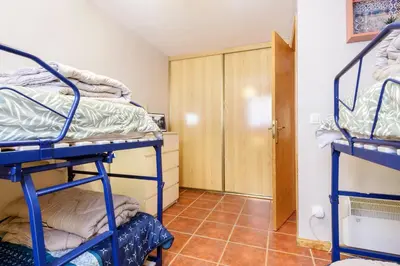 Cama o camas de una habitación en Amplio apartamento de montaña con terraza y WiFi