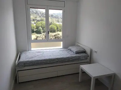 Cama o camas de una habitación en Apartamento boltaña
