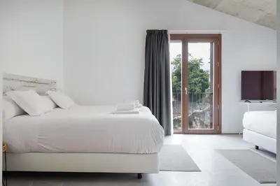 Cama o camas de una habitación en IRAIPE Estella Rooms Auto Check-in