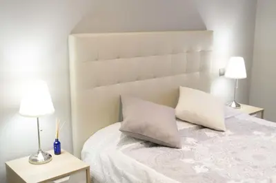 Cama o camas de una habitación en Apartamenticos Plaza Las Armas