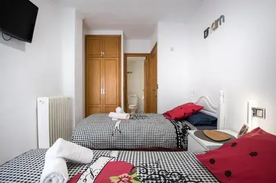Cama o camas de una habitación en Casa Campanilla Jaca