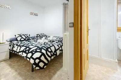 Cama o camas de una habitación en Casa Campanilla Jaca