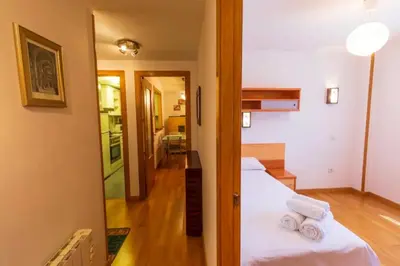Cama o camas de una habitación en Partacua - Centro de Panticosa con garaje y trastero - Pirineos360