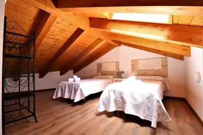 Cama o camas de una habitación en Casas Rurales Bestue-Ordesa