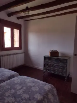 Cama o camas de una habitación en El Desván del Campanero apartamento con jardín