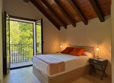 Cama o camas de una habitación en Hostal Iratibizkar