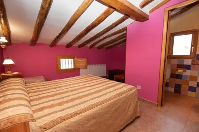 Cama o camas de una habitación en Casas rurales LA LAGUNA y LA BUHARDILLA DE LA LAGUNA