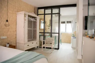 Cama o camas de una habitación en Apartamentos Rincón de Cantarranas