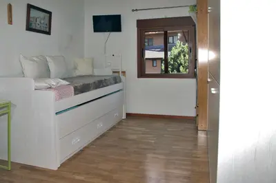 Una televisión o centro de entretenimiento en Apartamento en Baqueira a 100 metros de la telecabina