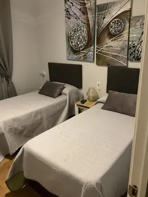 Cama o camas de una habitación en Habitacion doble en casa compartida con anfitriones