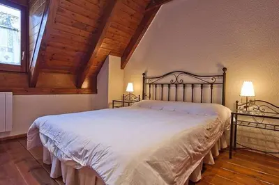 Cama o camas de una habitación en Salardu casa aranesa Cardenal