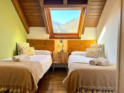 Cama o camas de una habitación en Apartament encantador, familiar i lluminós by RURAL D'ÀNEU