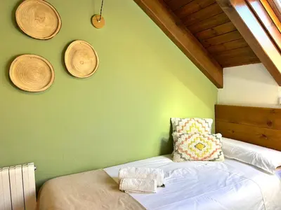 Cama o camas de una habitación en Apartament encantador, familiar i lluminós by RURAL D'ÀNEU