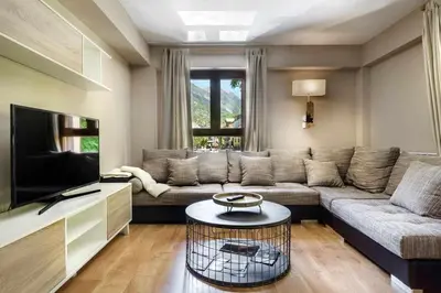 Una televisión o centro de entretenimiento en Musales, apartamento familiar en Panticosa