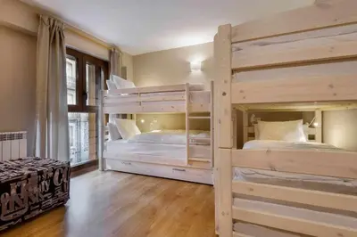 Cama o camas de una habitación en Musales, apartamento familiar en Panticosa