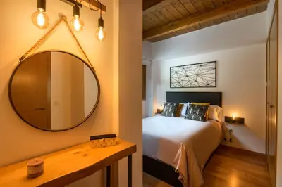 Cama o camas de una habitación en Chalet Casa La Cumbrecita en Panticosa