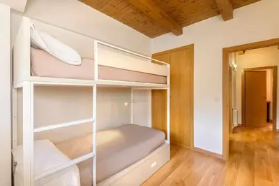 Cama o camas de una habitación en Chalet Casa La Cumbrecita en Panticosa