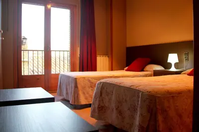 Cama o camas de una habitación en Hostal Cafeteteria Goya