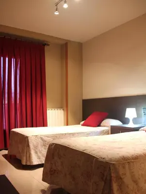 Cama o camas de una habitación en Hostal Cafeteteria Goya