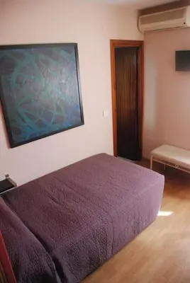 Cama o camas de una habitación en Hostal Delgado