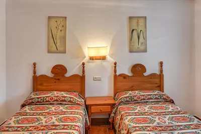 Cama o camas de una habitación en Apartamentos Petronilla