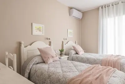 Cama o camas de una habitación en Hostal Buenos Aires