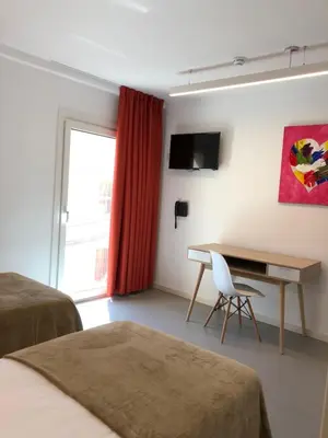 Una televisión o centro de entretenimiento en Epsilon Alcañiz Hotel
