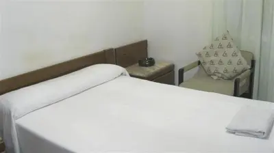 Cama o camas de una habitación en Pensión Iglesias