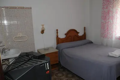 Cama o camas de una habitación en Pensión Iglesias