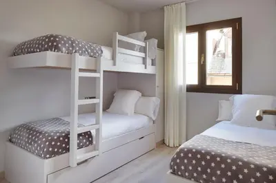 Cama o camas de una habitación en Pujolo by FeelFree Rentals