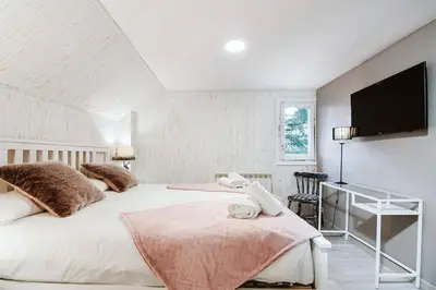 Cama o camas de una habitación en CASA FIR by Cardi Suites
