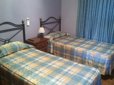 Cama o camas de una habitación en Hostal Can Barrina