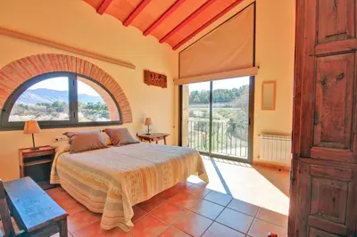 Cama o camas de una habitación en Mas Del Cigarrer Allotjament Rural