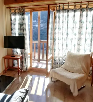 Una televisión o centro de entretenimiento en Apartament Ca de Gallisca Taüll Vistas Espectaculares