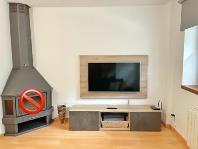 Una televisión o centro de entretenimiento en Apartamento Casa Chloe