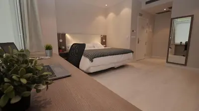 Cama o camas de una habitación en Hotel Ciudadela Pamplona