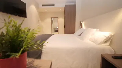 Cama o camas de una habitación en Hotel Ciudadela Pamplona