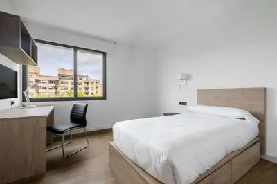 Cama o camas de una habitación en Micampus Pamplona Student Residence