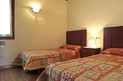 Cama o camas de una habitación en Apartamentos Irati Olaldea