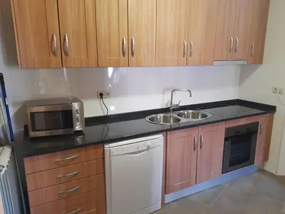 Una cocina o zona de cocina en Apartamentos Farrai llova