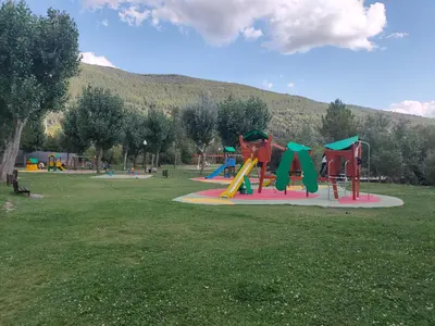 Zona de juegos infantil en Apartamento Diezcapanas