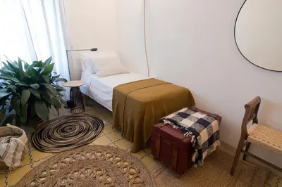 Cama o camas de una habitación en L'Hostatgeria del Celler