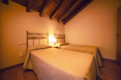 Cama o camas de una habitación en Apartamentos Camino de la Val