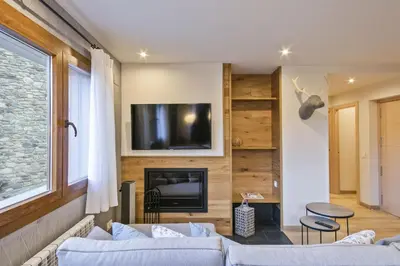 Una televisión o centro de entretenimiento en Luderna - Apartamento Des Puis