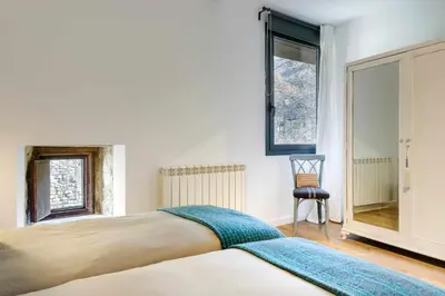 Cama o camas de una habitación en La Borda del Pueyo, borda rural pirineo aragonés