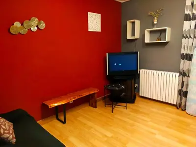 Una televisión o centro de entretenimiento en Apartamento turístico Larraga
