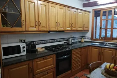 Una cocina o zona de cocina en Ca l'Andròmines