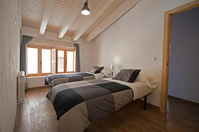 Cama o camas de una habitación en Casa Rural Muro de Aguas - Valdeté