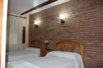 Cama o camas de una habitación en Casa Rural Laura