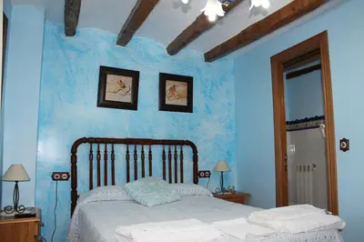 Cama o camas de una habitación en Casa Rural Laura